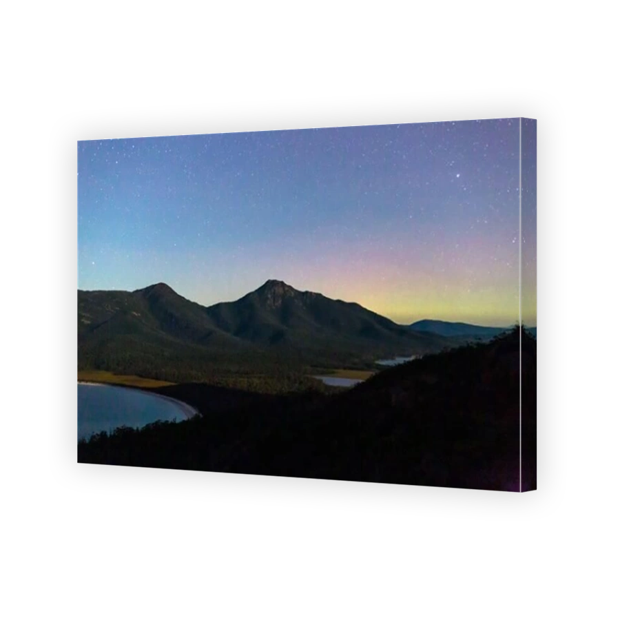 Aurora Australis or Southern Lights over Wineglass Bay and Mount Freycinet