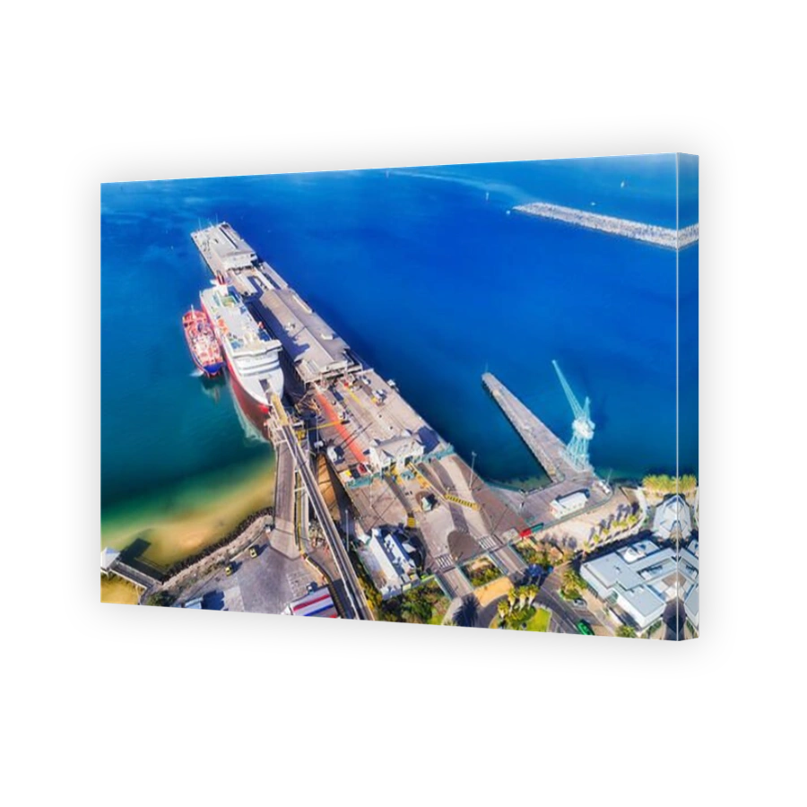 Port Phillip bay Port Melbourne trans tasmanian ferry wharf terminal and port crane - cargo and passenger infrastructure in Melbourne, Australia.