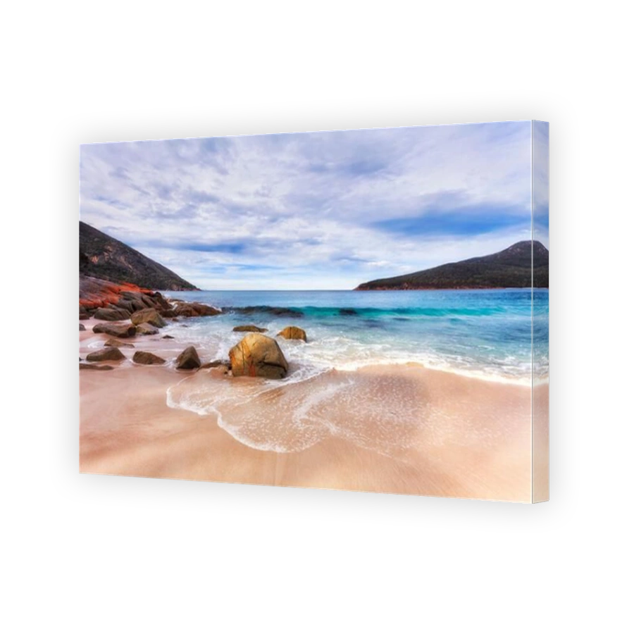 Waterfront of Pacific ocean waves on Wineglass bay beach of Freycinet peninsula and national park, Tasmania, Australia.