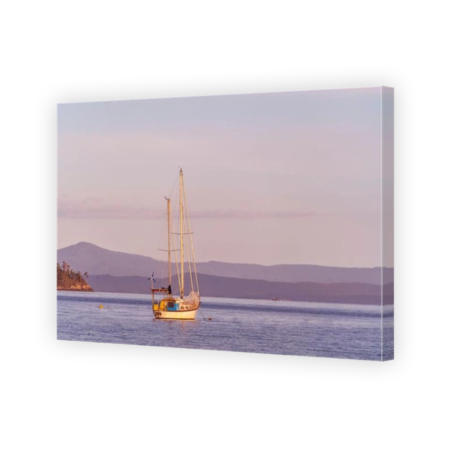 Yacht at anchor in calm waters of Port Esperance, Dover, Tasmania