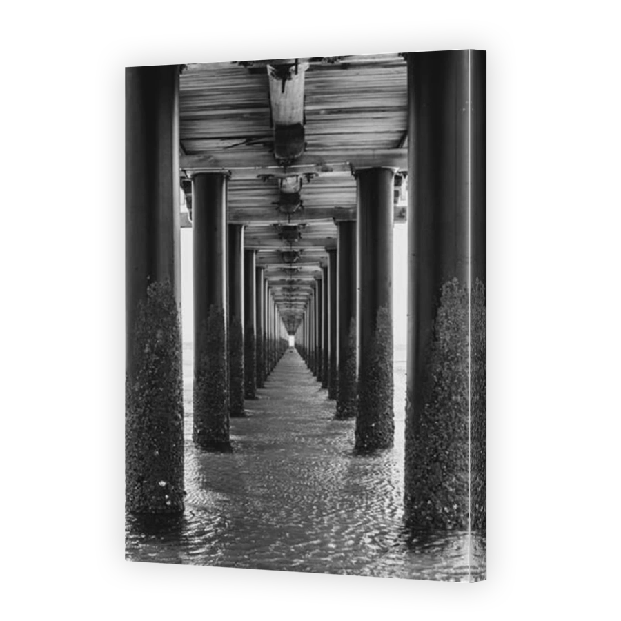 Looking underneath long wooden Pier