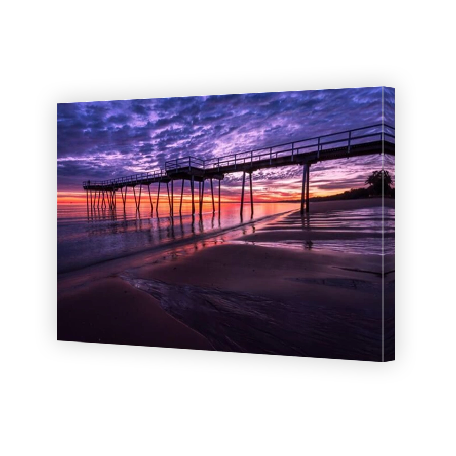 Sunrise sunset under seaside pier