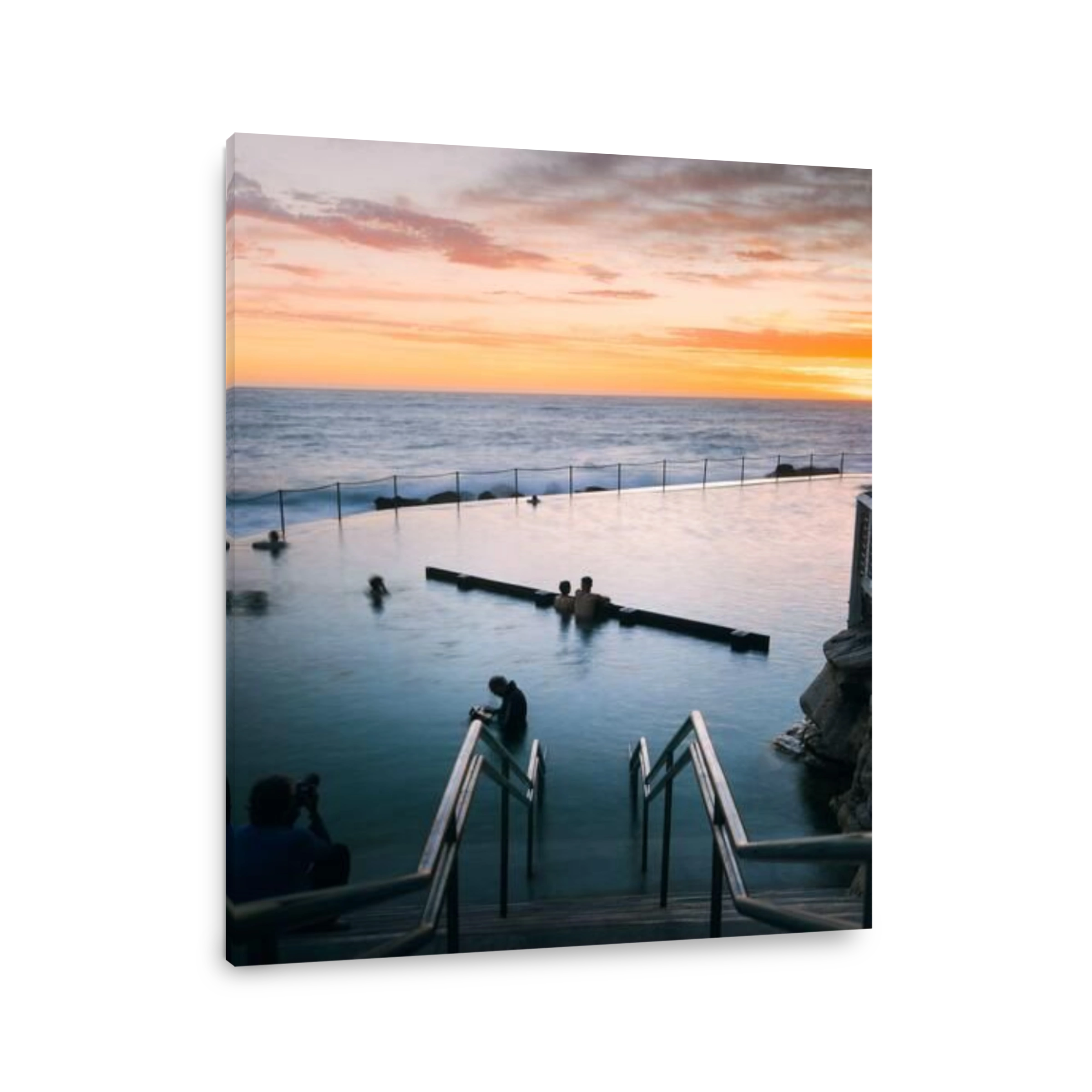 SYDNEY, AUSTRALIA - Jan 24, 2021: Sunrise and cloud filled sky over a peaceful ocean pool.