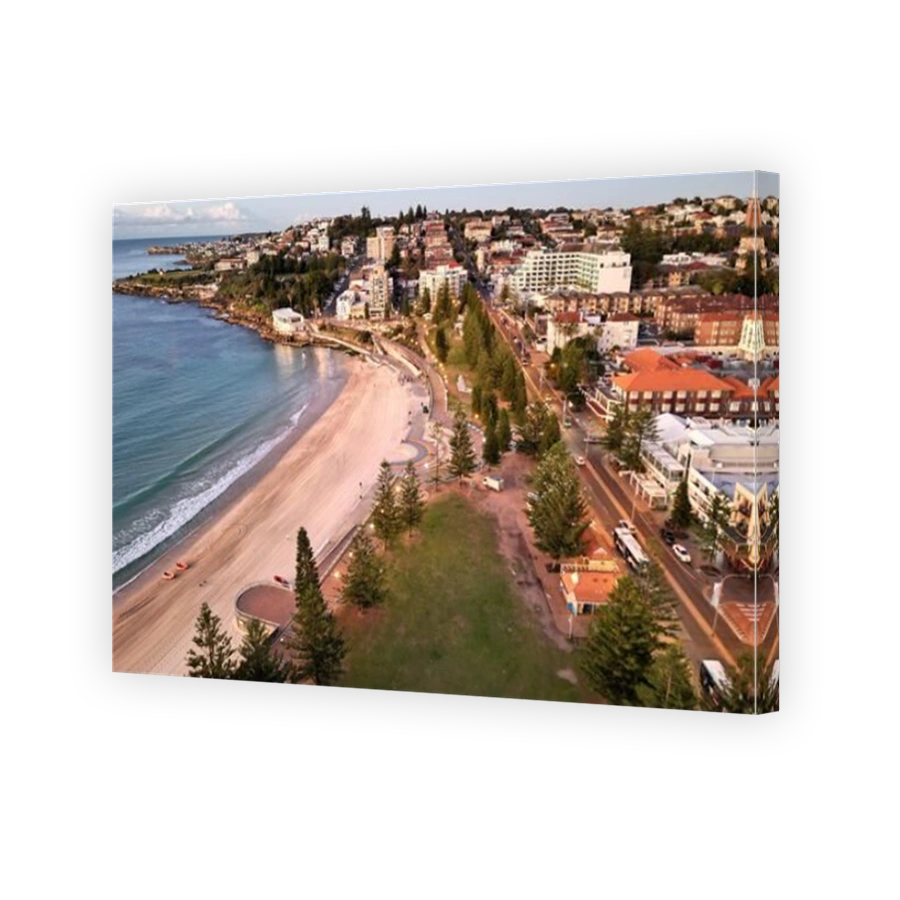 A breathtaking aerial view of Coogee Beach in Sydney, Australia with a gentle sea beside the city