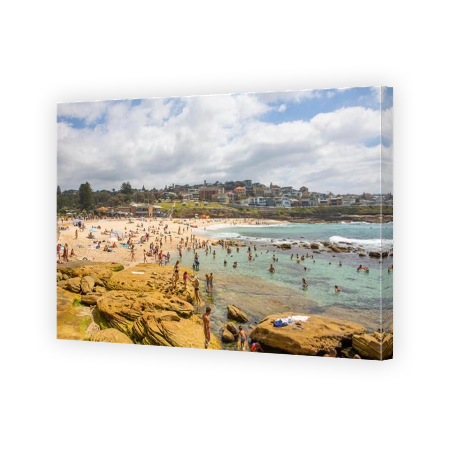 Bronte beach and people relaxing on the sand and in the ocean,Sydney,Australia