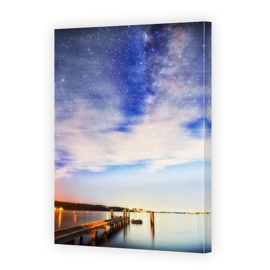 Lake Macquarie jetty under endless Mikly Way starry sky in Australia at night.