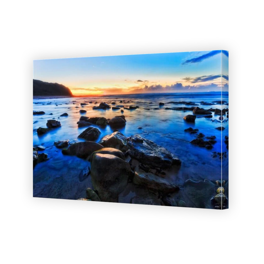 Scenic blue hour sunrise dawn time at Hams beach of Australian pacific coast in Caves beach town.