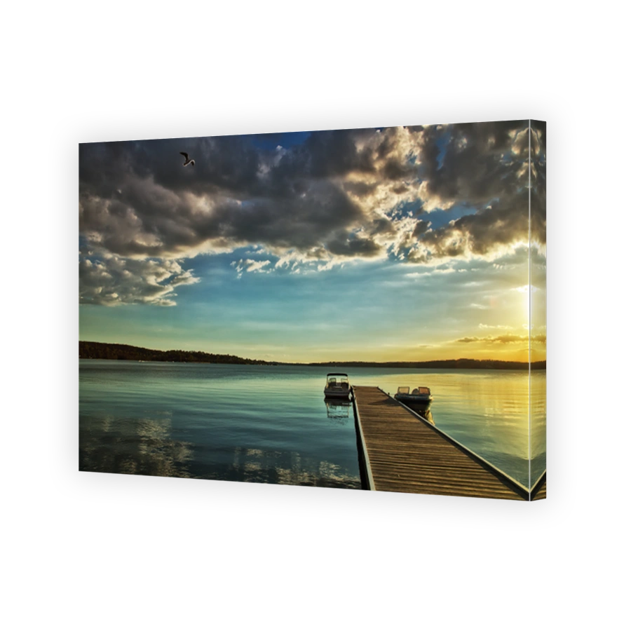 Beautiful Lake Macquarie sunset with jetty and motor boats