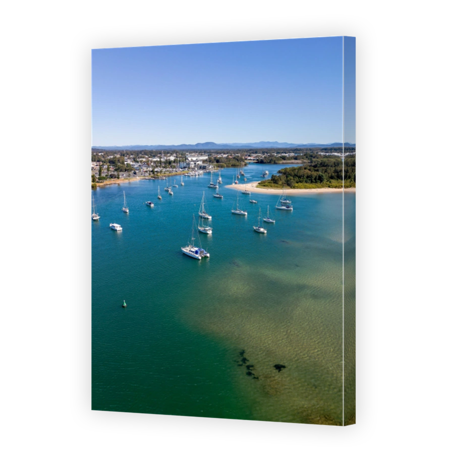 Vertical shot of Port Macquarie with boats sailing in New South Wales, Australia, in sunny weather