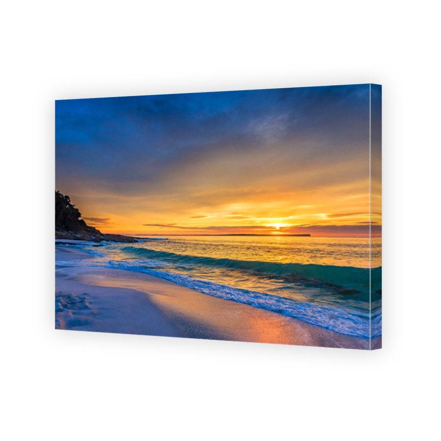 Idyllic sandy beach under a gloomy sunset sky
