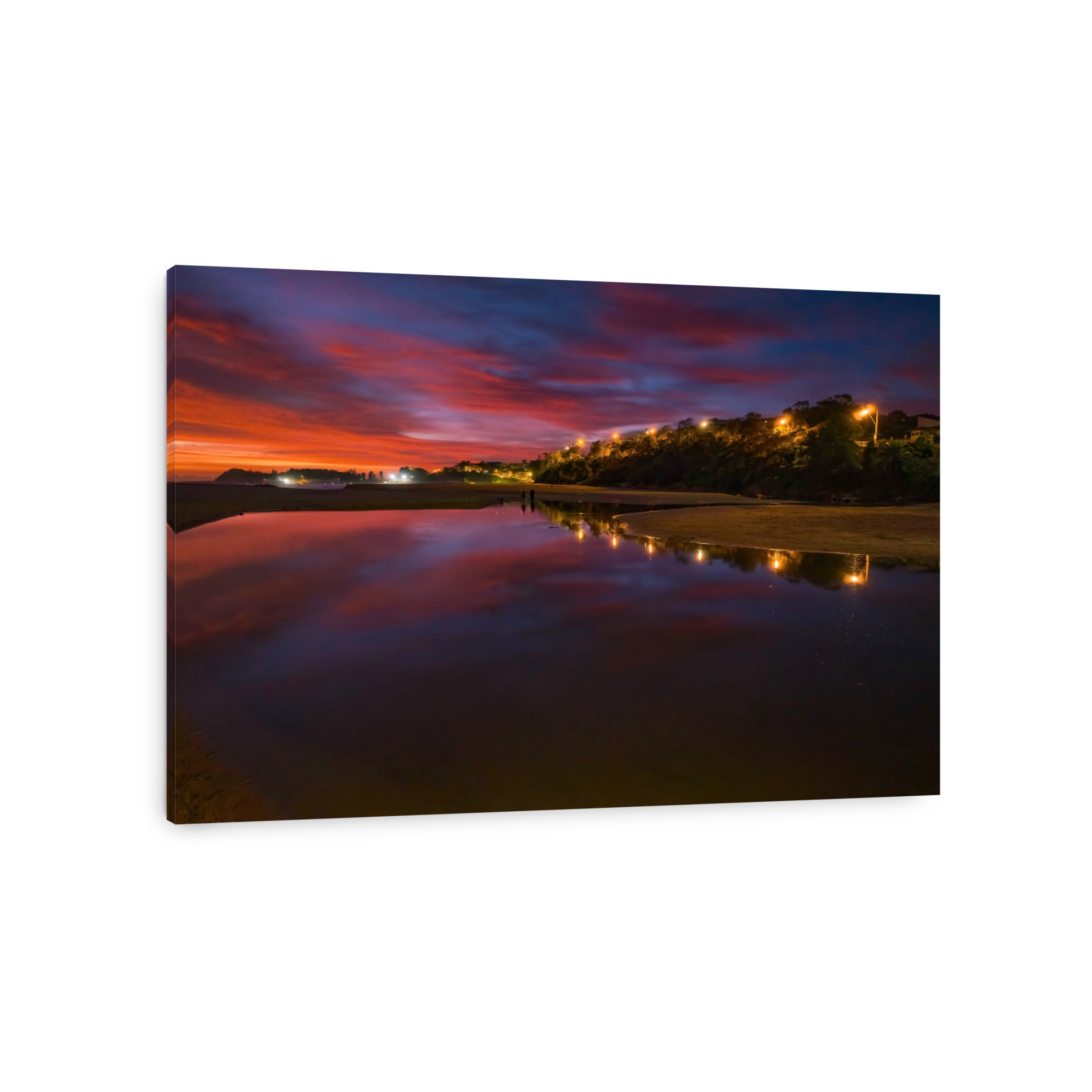 High cloud sunrise at the seaside with street lights and reflections