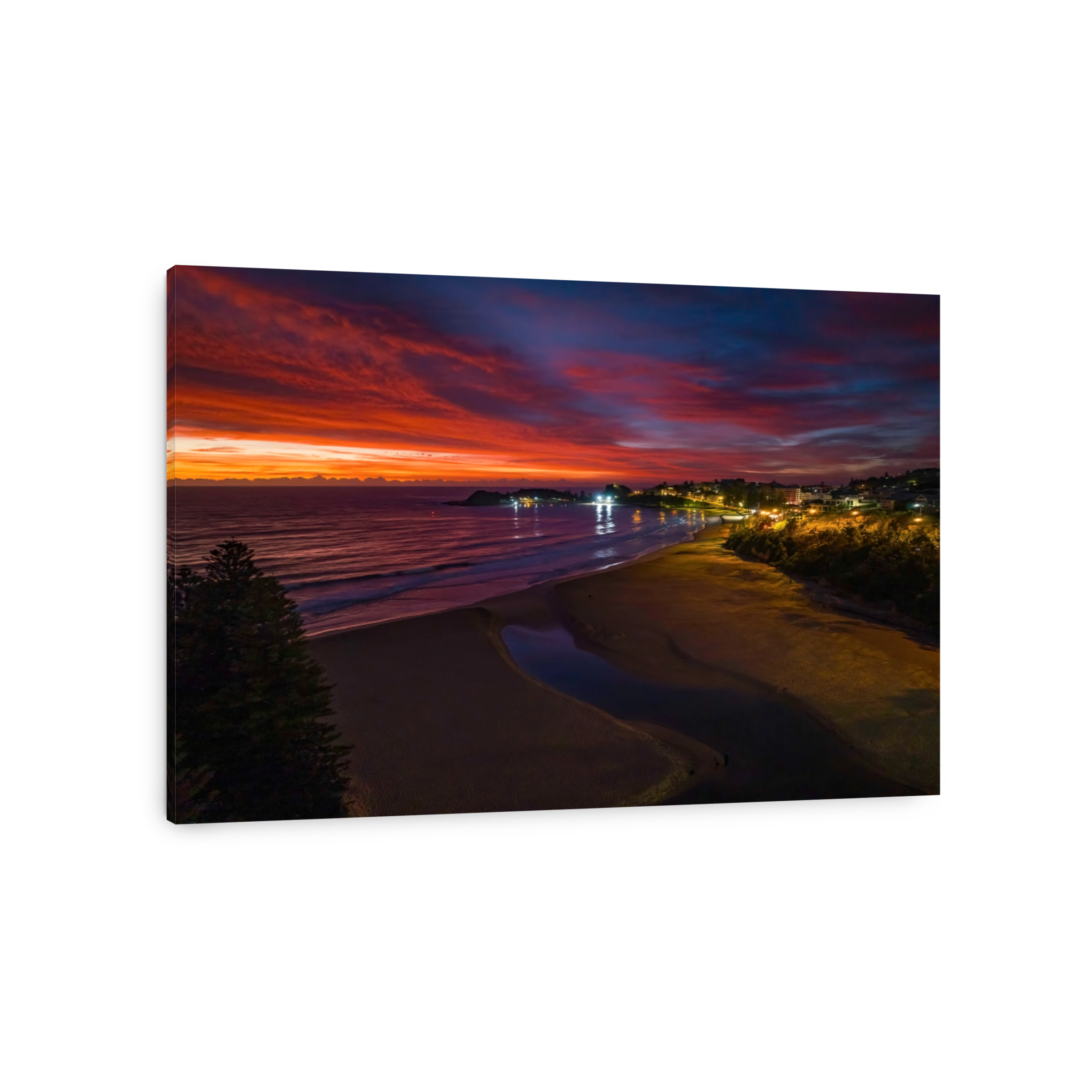 High cloud sunrise at the seaside with street lights and reflections