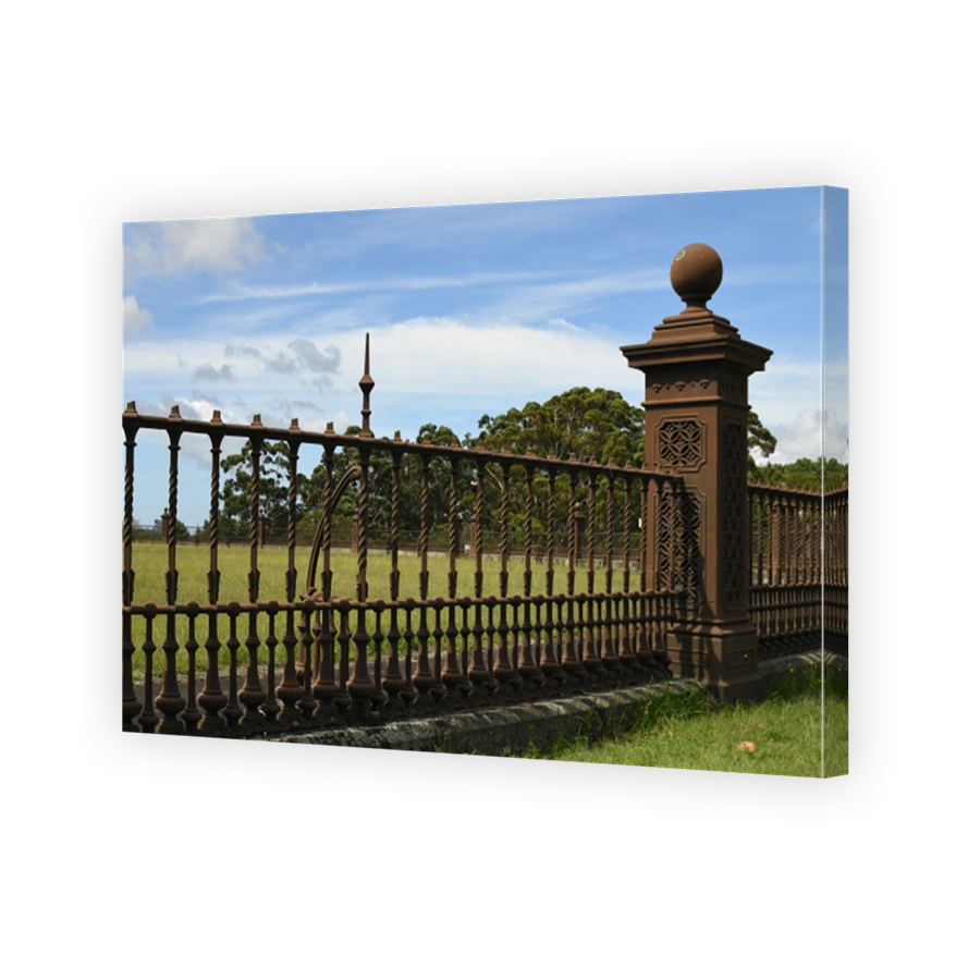 Ornate wrought iron railings surrounding heritage-listed Centennial Park Reservoir 1 on Oxford Street, Centennial Park, New South Wales, Australia.