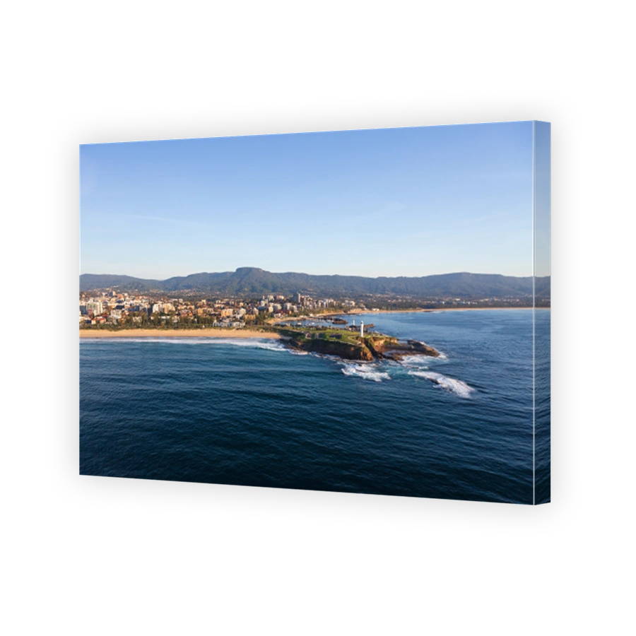 Wollongong's iconic Flagstaff Hill and harbour featuring its famous dual lighthouses looking west to the Illawarra escarpment.