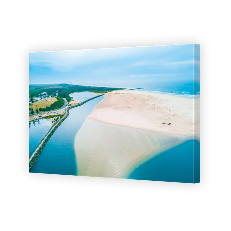 Aerial view of Harrington breakwall and Manning river mouth. Harrington, New South Wales, Australia