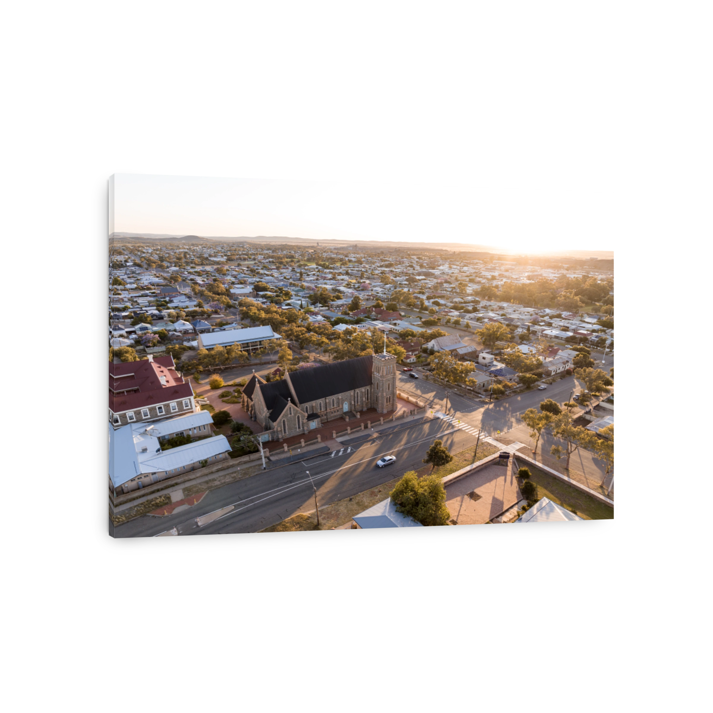 Early morning sunrise high angle aerial drone view of the Cathedral of the Sacred Heart of Jesus, a catholic church, and the historic outback mining town of Broken Hill, New South Wales, Australia.