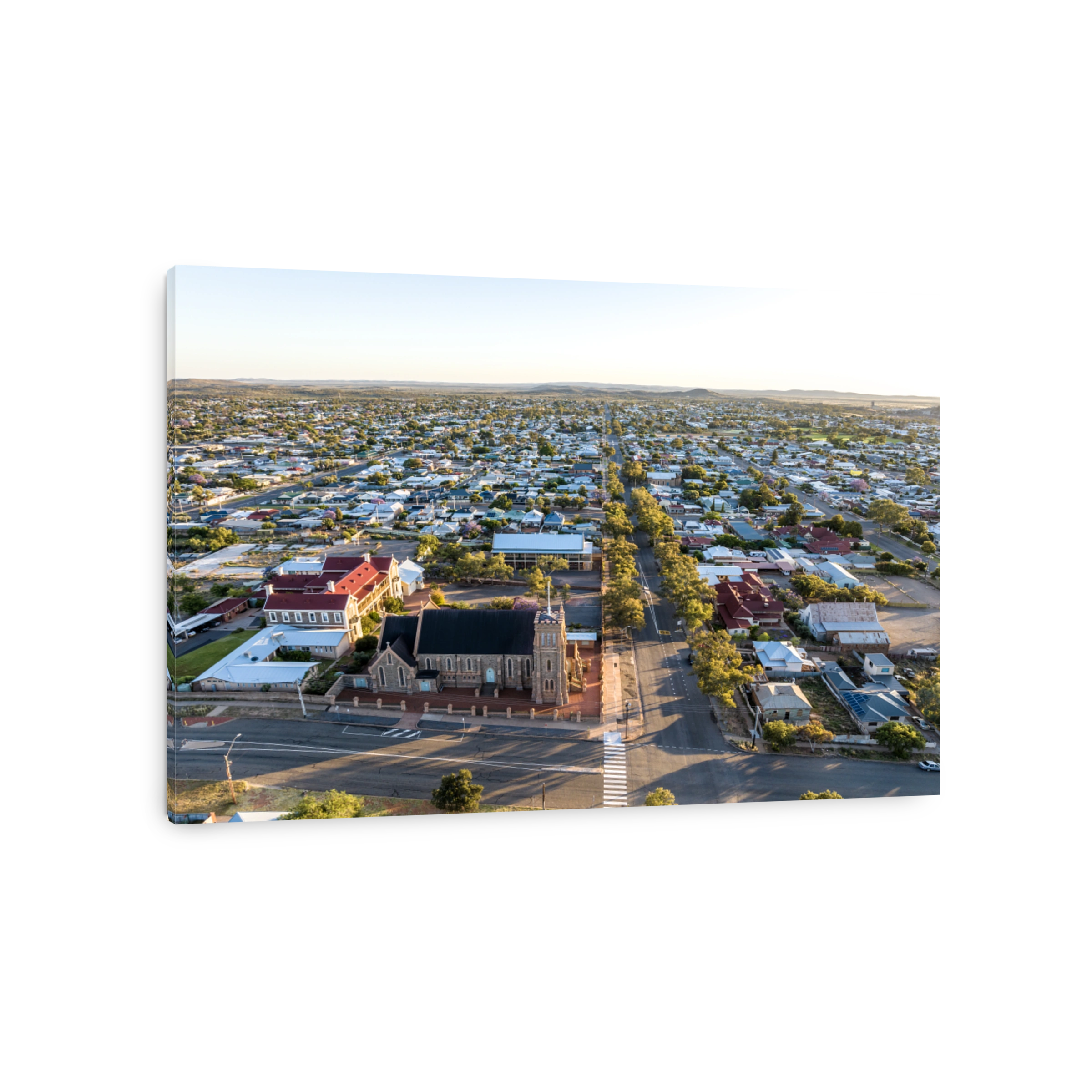 Early morning sunrise high angle aerial drone view of the Cathedral of the Sacred Heart of Jesus, a catholic church, and the historic outback mining town of Broken Hill, New South Wales, Australia.