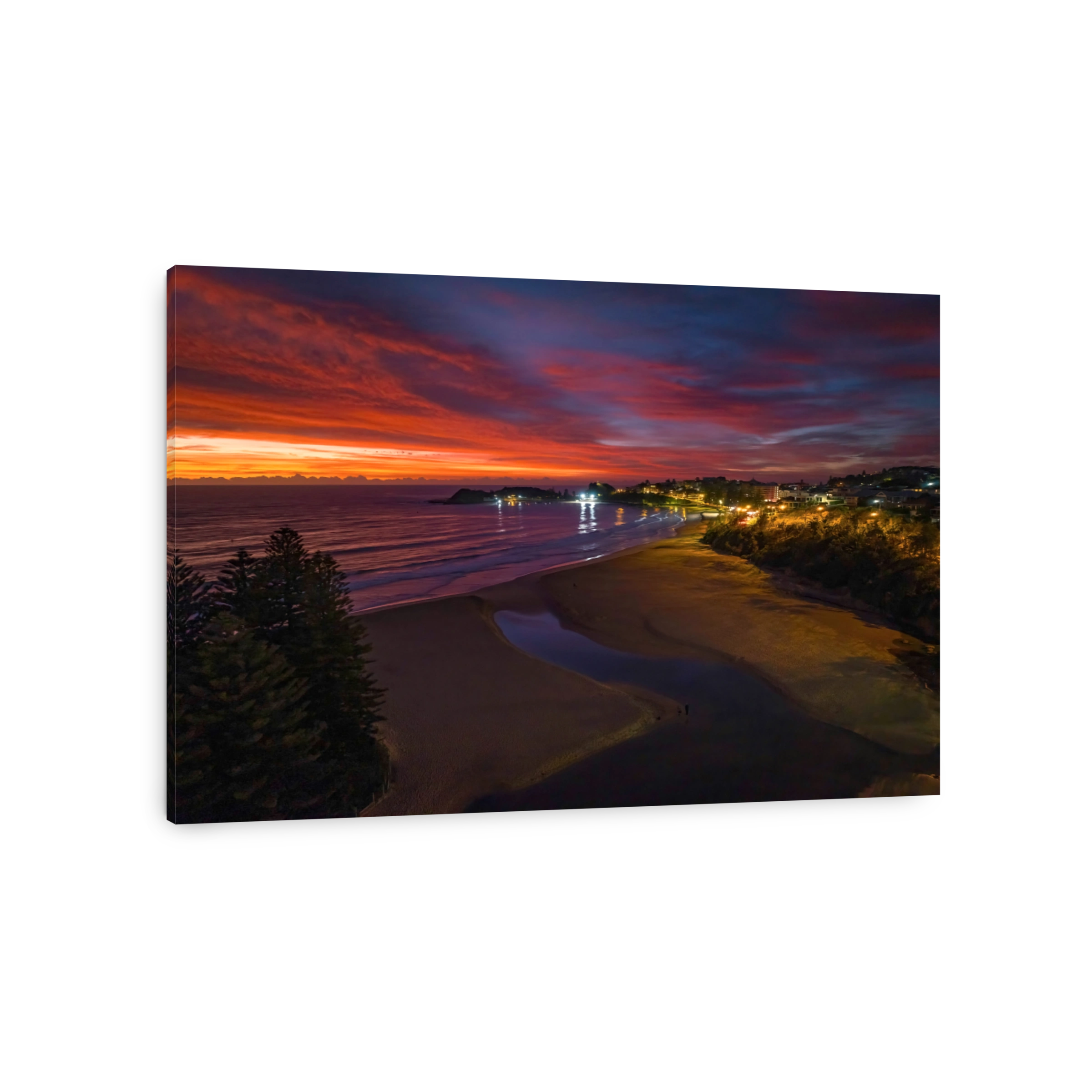 High cloud sunrise at the seaside with street lights and reflections