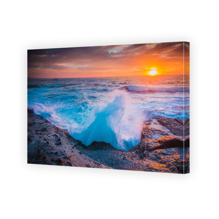 The whooosh of waves as they break over the coastal rocks