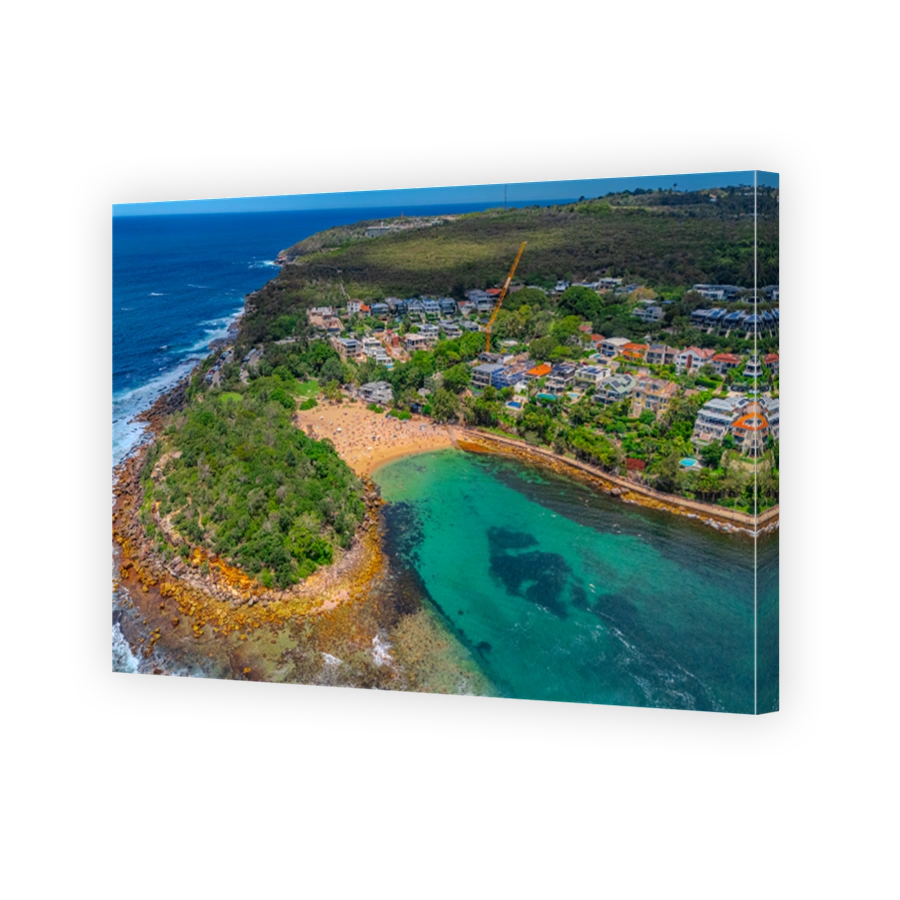 Aerial View of Manly Beach and Sydney harbour with manly houses on a warm summer day blue skies Sydney NSW Australia
