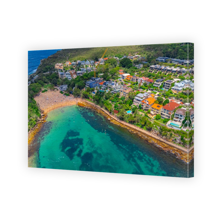 Aerial View of Manly Beach and Sydney harbour with manly houses on a warm summer day blue skies Sydney NSW Australia