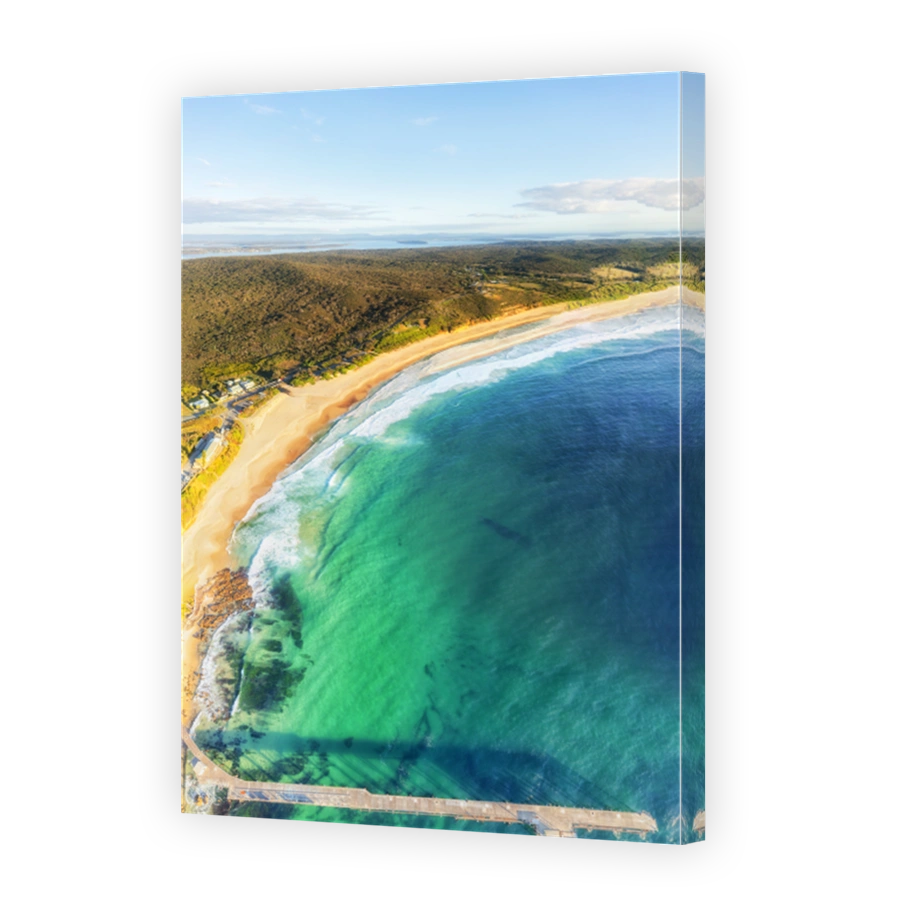 Serene coastal landscape with jetty and ocean