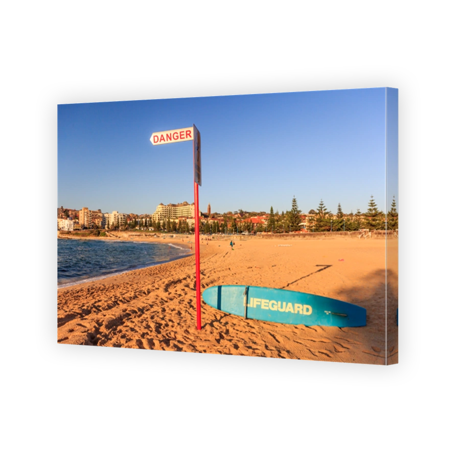 Coogee Beach lifeguard surfboard and danger sign