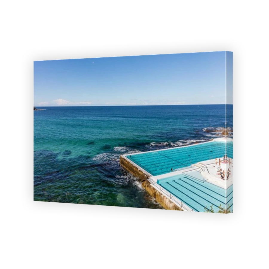 Swimmers at swimming pool overlooking Bondi beach in Sydney, NSW, Australia