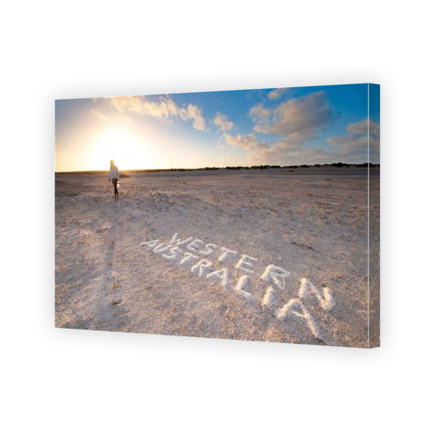 A woman walking on the rare shell beach with sunrise in Western Australia