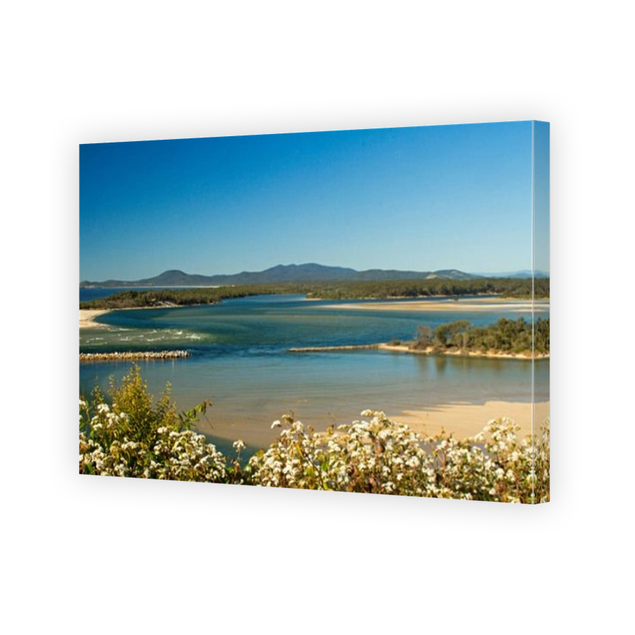 Spectacular panoramic view of coast, sandy beaches, extensive river estuary, and distant ranges from lookout at Nambucca Heads in NSW Australia