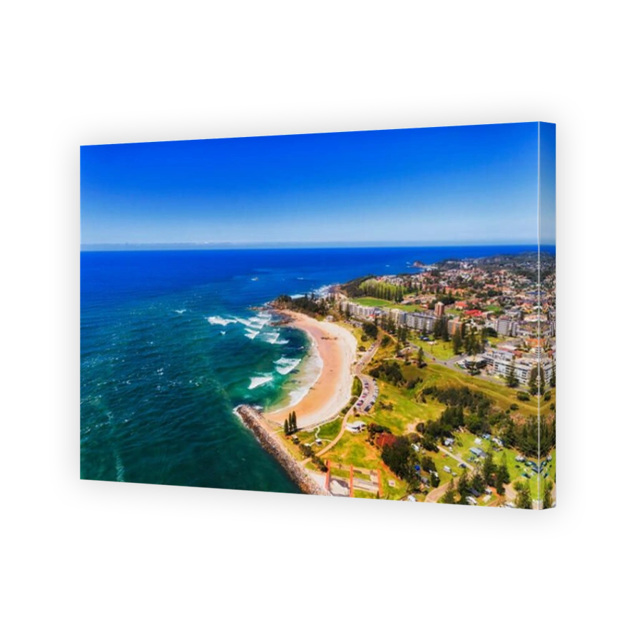 Port Macquarie on Australian NSW pacific coast seen from above around river delta and local beach adjusted to caravan park for tourists.