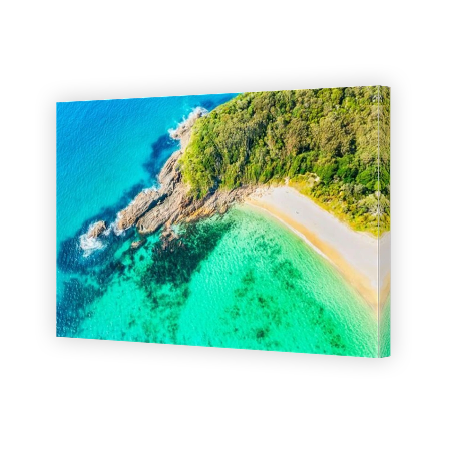 Shelly beach with pristine clean emerald tropical water and white sand on pacific coast of Australia at Elizabeth beach bay.