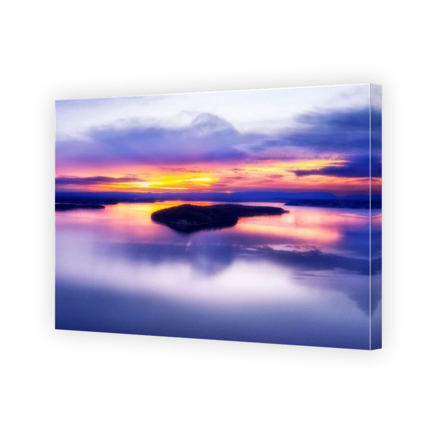 Colourful scenic sunset over Dangar island on calm mirror of Lake Macquarie Pacific ocean lagoon in Australia.
