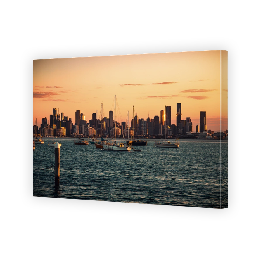 The view of the urban skyline of Melbourne in the dawn from Williamstown