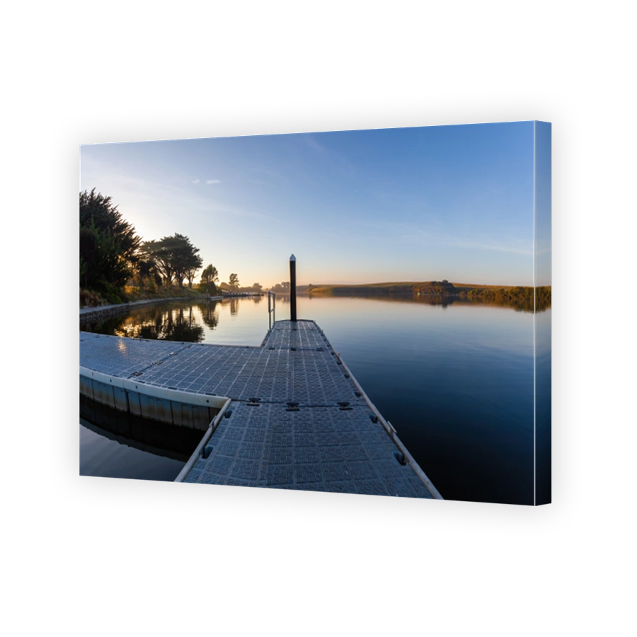 Small pier on Hopkins River at sunrise with copy space. Allansford, Victoria, Australia
