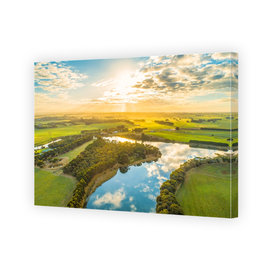 Aerial landscape of sunset over river in rural area