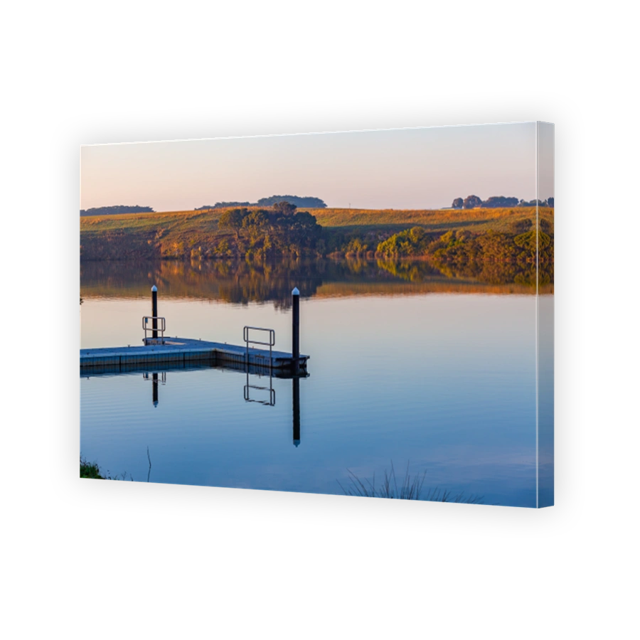 Small pier on Hopkins River at sunrise. Warrnambool, Victoria, Australia