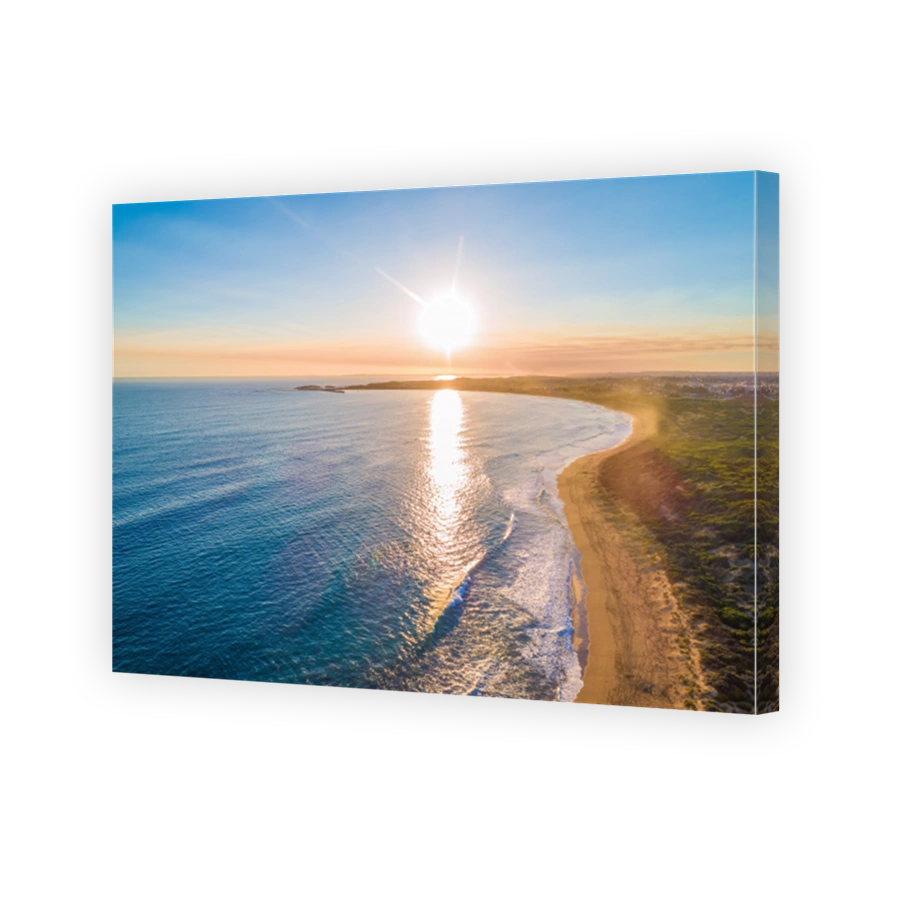 Sunset over coastline - aerial view