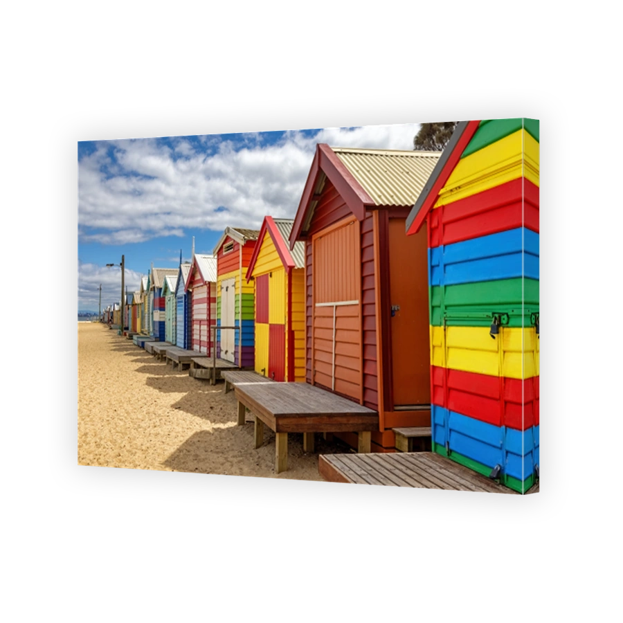Brighton beach Victorain bathing boxes. Brightly painted colourful beach huts line the sand in Melbourne, Australia. They are highly desirable and extremely expensive real estate.