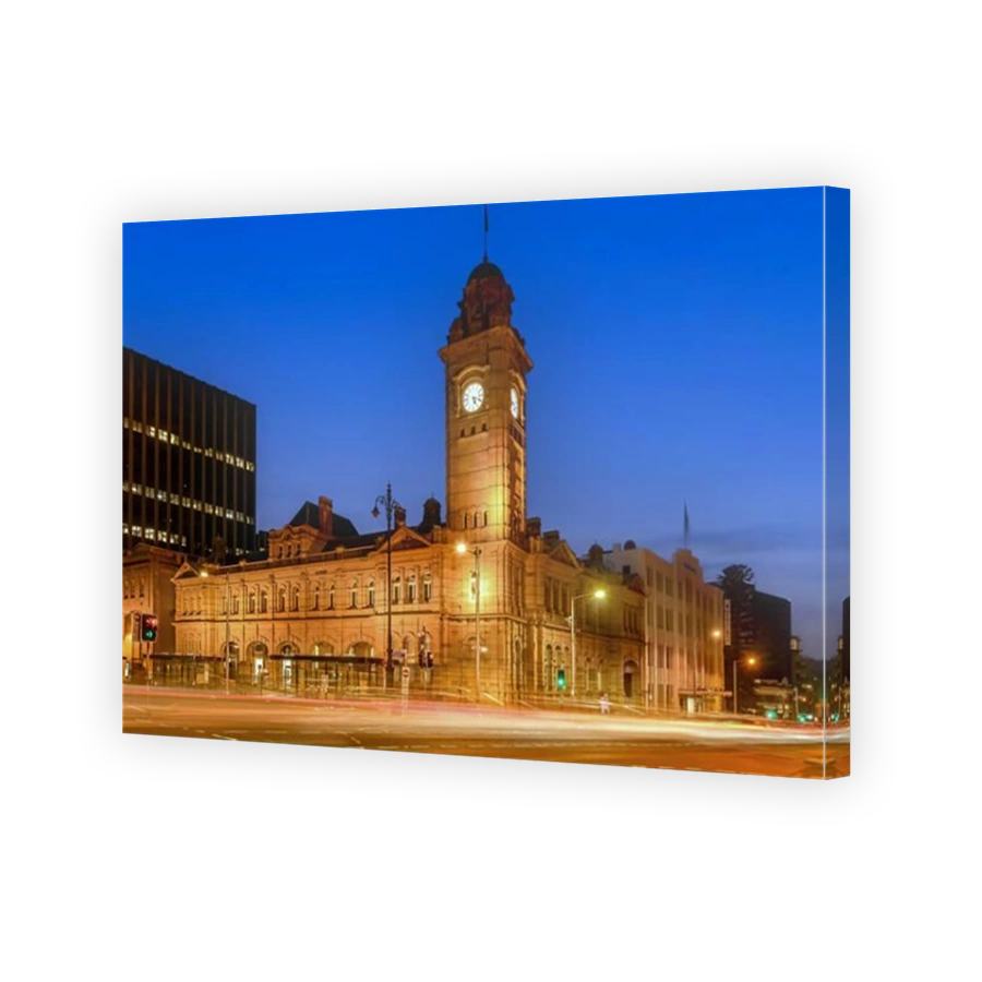 The Hobart General Post Office (GPO) is a landmark sandstone building in Hobart Tasmania Australia. Car light trails are on the road in the foreground