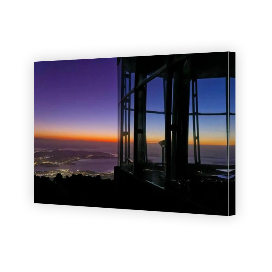View of Hobart from Pinnacle observation shelter lookout on Mount Wellington at sunrise dawn with rocks clear sky orange horizon Tasmania, Australia
