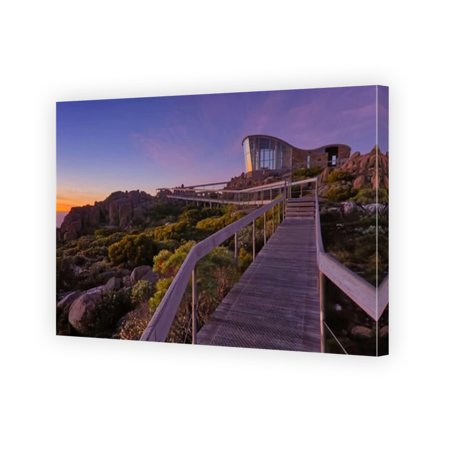 View of Hobart from Pinnacle observation shelter lookout on Mount Wellington at sunrise dawn with rocks clear sky orange horizon Tasmania, Australia