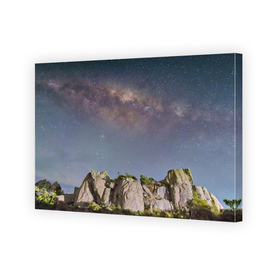 Galactic centre of Milky Way captured at night with rock outcrop in foreground on Mount Wellington, Hobart, Tasmania, Australia