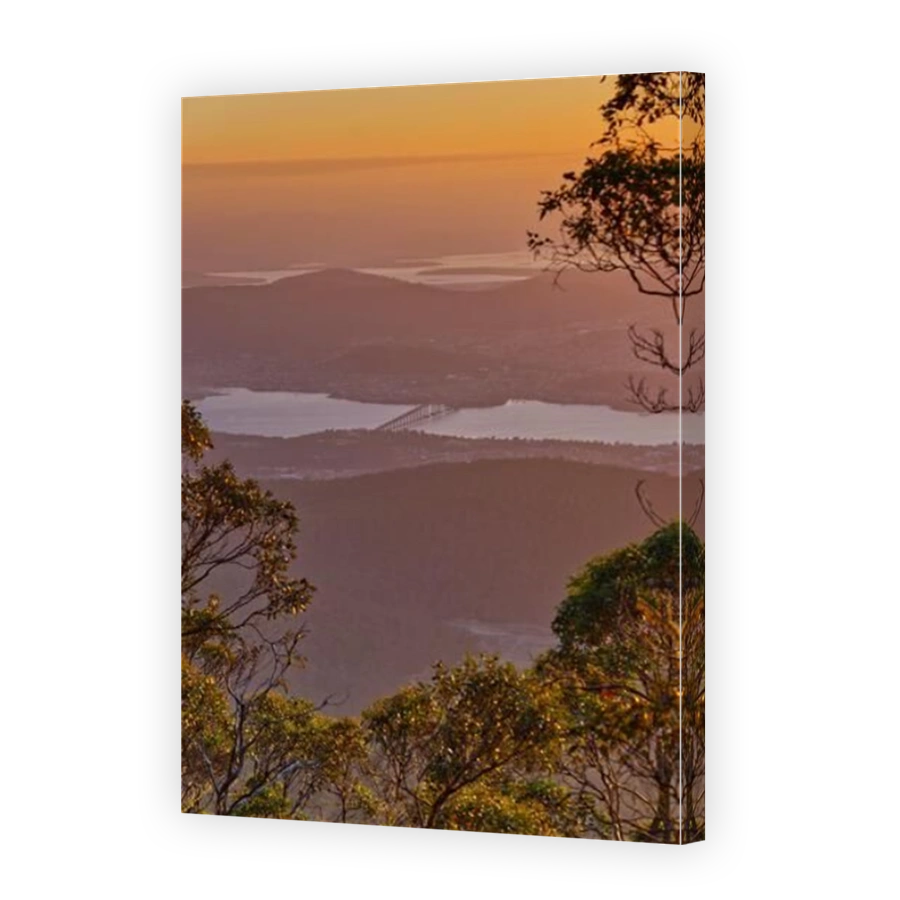 View of the Derwent river ranges and Tasman bridge at sunrise from Mount Wellington Organ Pipes track, Hobart, Tasmania, Australia
