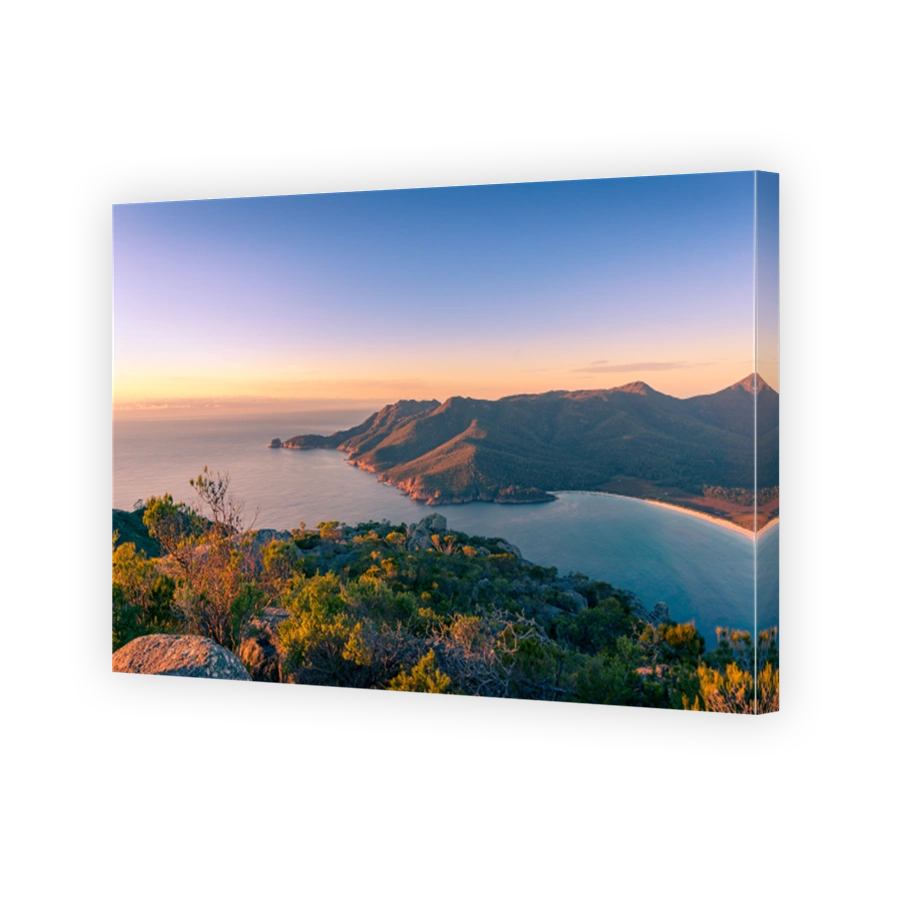 Sunrise landscape of ocean coastline with mountains and beach
