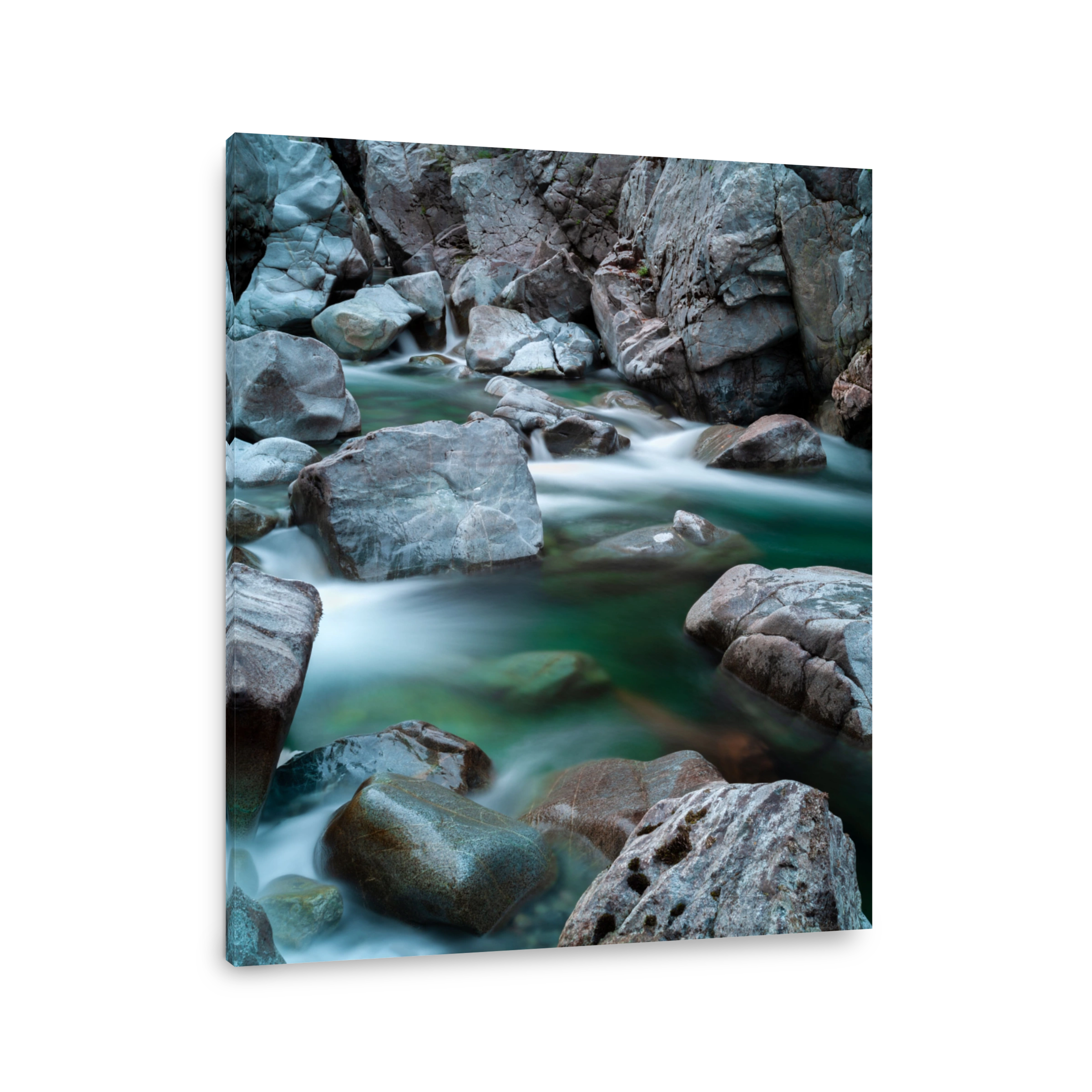 Vertical shot of rocks in Gordon River in Canada, long exposure
