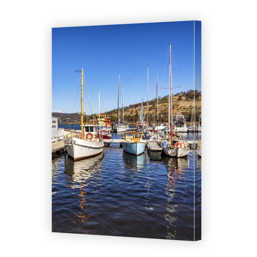 Reflections of boats on Huon River, Huon Valley, Tasmania