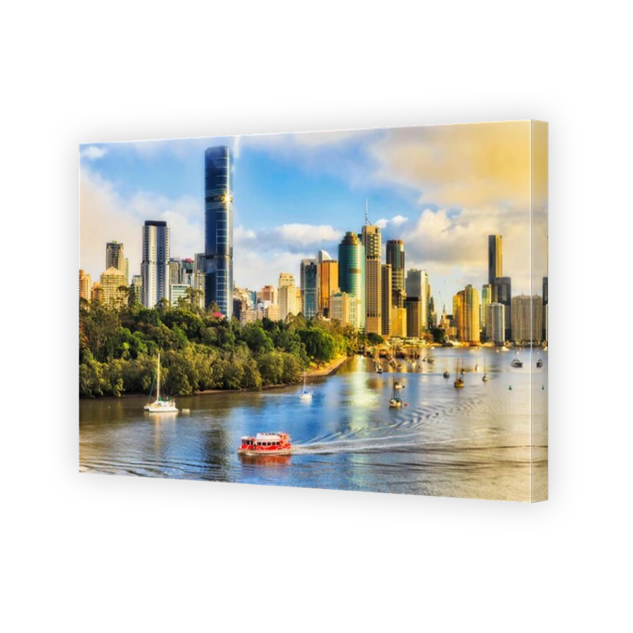 Red ferry transporting passangers during morning communte across Brisbane river in Brisbane city in front of city CBD waterfront seen from elevation o