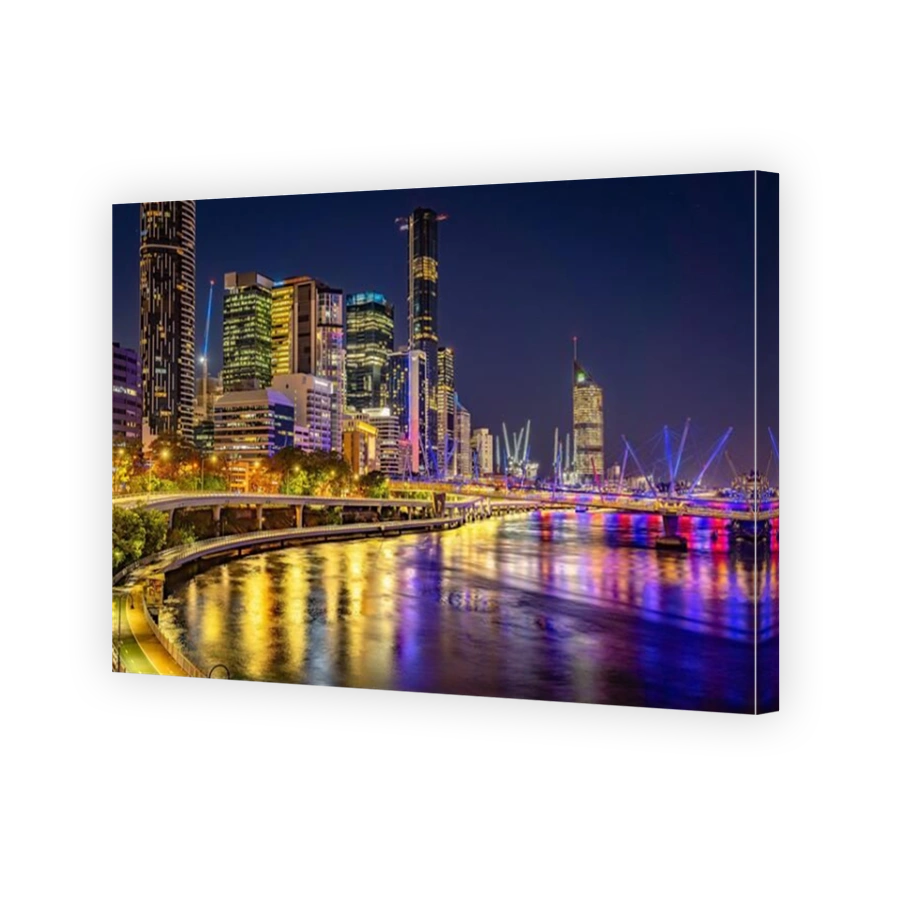 Brisbane, Australia - City illuminated at night with Kurilpa bridge across the river