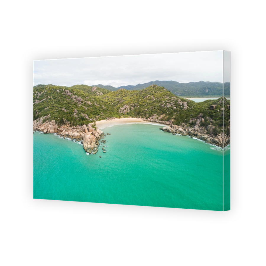 Aerial views over a tropical island in a middle of an archipelago